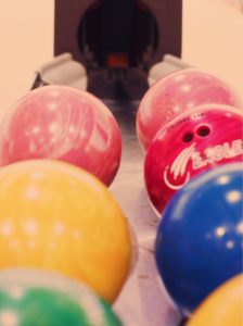 bowling balls in the return system rack